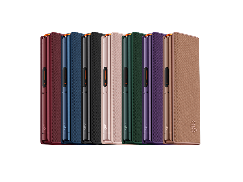 A row of nine sleek, rectangular electronic devices in various colors, including red, blue, black, pink, green, and beige, standing upright on a light background.