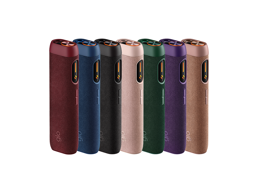 Seven electronic devices with a fabric texture, each in a different color (red, blue, black, pink, green, purple, and brown), arranged in a row against a white background.