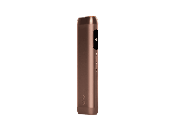 The glo™ HILO is a sleek, cylindrical metallic brown device with a small display and side buttons, featuring Turbostart technology. It stands upright against a plain light background.