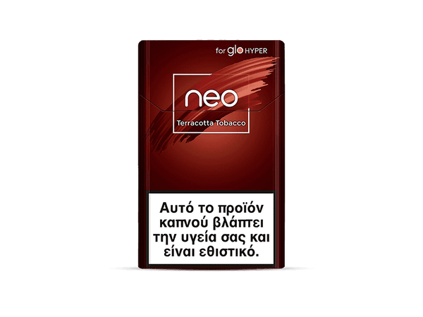 A red cigarette pack labeled neo™ Terracotta Tobacco with a large white health warning in Greek at the bottom, stating that this tobacco product damages health and is addictive.